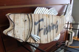 Wooden fish sign in the Minnesota Fishing Museum gift shop