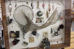 Net, lures, and reels shown in the Minnesota Fishing Museum